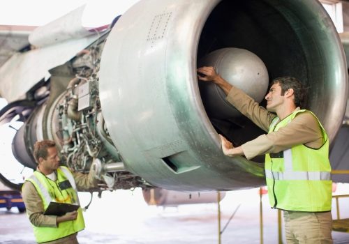 Aircraft workers checking airplane